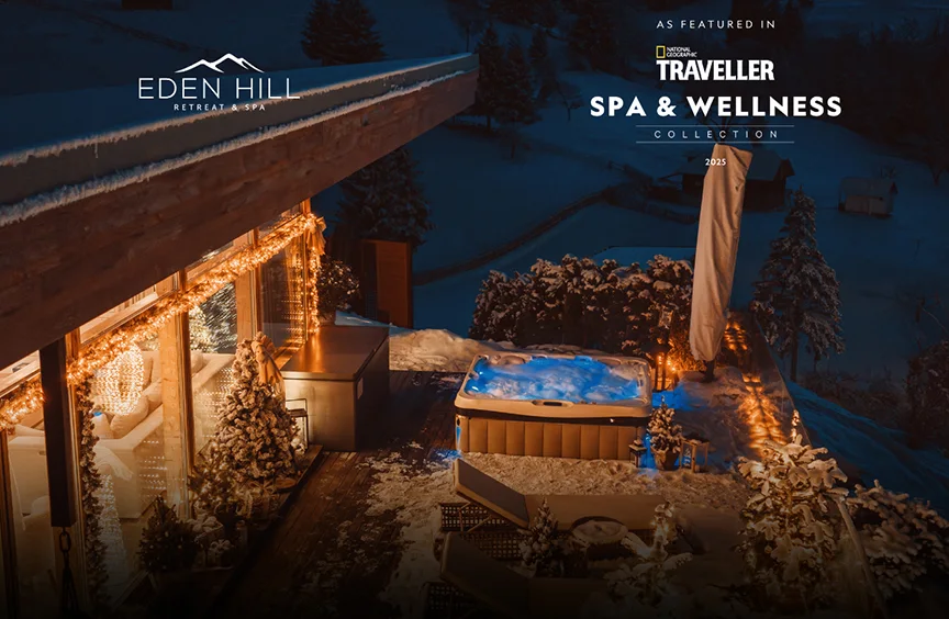 Snowy Eden Hill terrace with festive lights and a hot tub, in a National Geographic Traveller Spa & Wellness Collection composition.